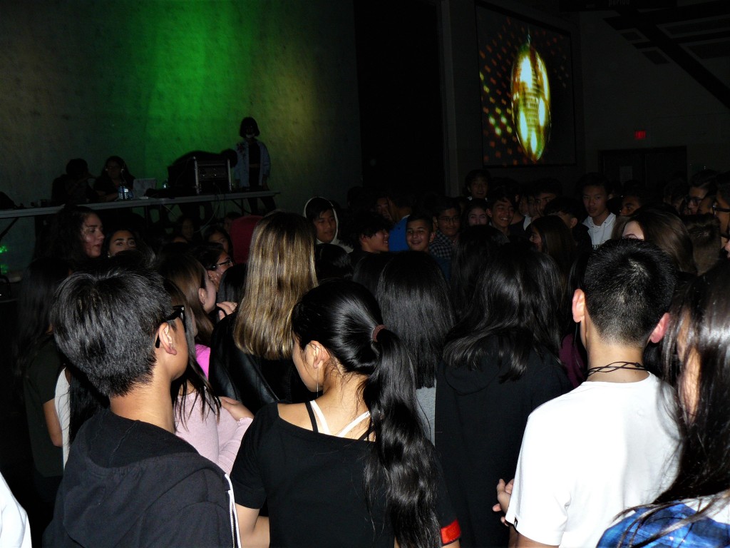 Students stress-relieve from their first month at school by enjoying themselves at the grade nine dance.